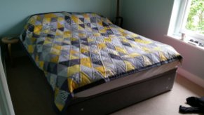 Yellow and grey triangle quilt